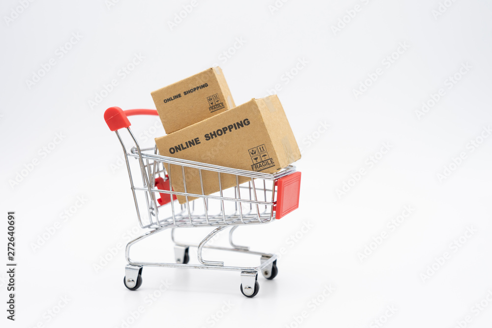 Online shopping with a shopping cart and shopping bags delivery service using as background shopping concept and delivery service concept with copy space  for your text or  design.