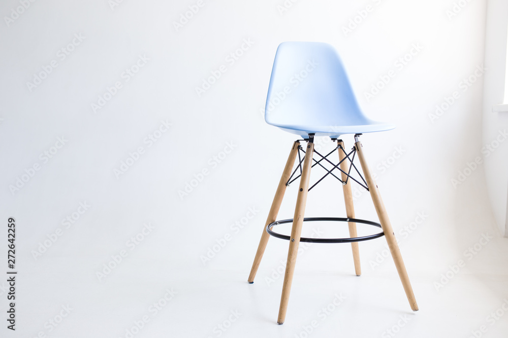 Blue wooden chairs for the legs on a white background. White cyclorama in the studio. Isolated.