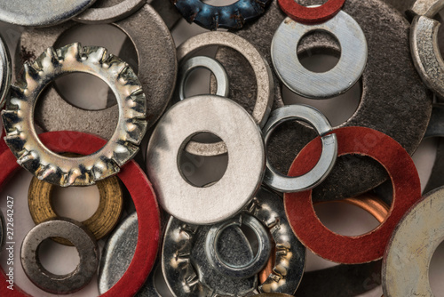 Divers industrial washers and rings. Various colorful washers rings on white background Screw washer