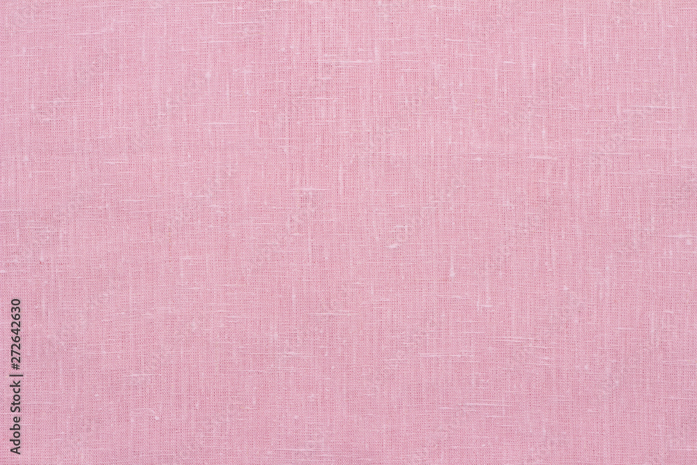 Fototapeta premium Pink linen pastel fabric, background or texture, closeup, top view, horizontal