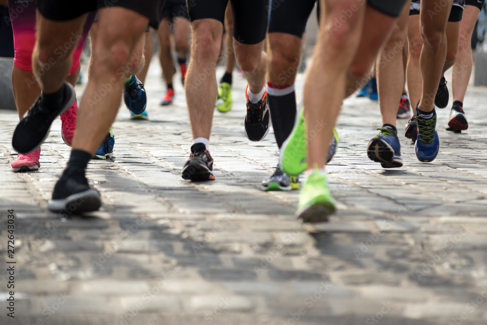 Legs of people running on the street, front view Legs of people running on the street, front view