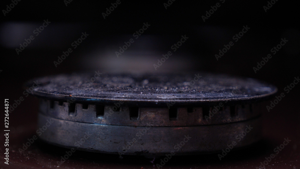 Very closely displayed as the gas stove is lit, checking on and off. Concept of: Gas, Stove, Kitchen. Very closely displayed as the gas stove is lit, checking on and off. Concept of: Gas, Stove, Kitchen.
