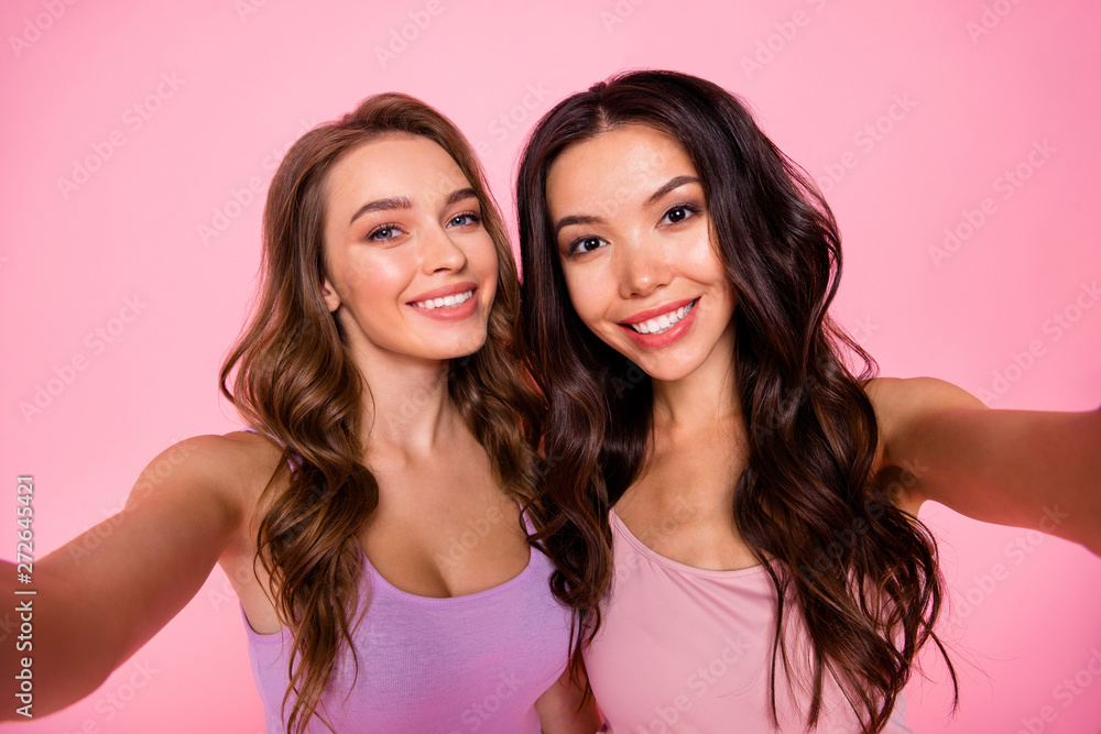 Close up photo content attractive youngster satisfied excited free time weekend holidays wavy curly long trendy candid hairstyle hairdo make photos fashionable outfit isolated stylish pink background Close up photo content attractive youngster satisfied excited free time weekend holidays wavy curly long trendy candid hairstyle hairdo make photos fashionable outfit isolated stylish pink background