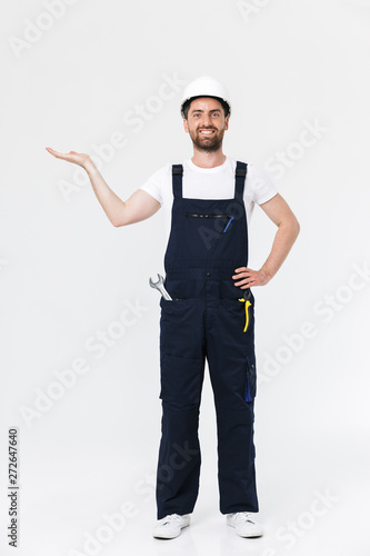 Full length portrait of a handsome bearded builder man