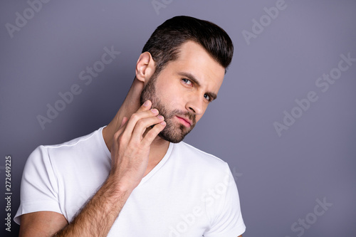 Close up photo amazing he him his macho perfect appearance touch arm hand bristle not sure quality stylist visit not smiling look mirror bath shower wear casual white t-shirt isolated grey background