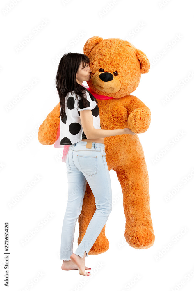 Portrait of young sexy girl with huge teddy bear isolated at white  background. Stock Photo | Adobe Stock