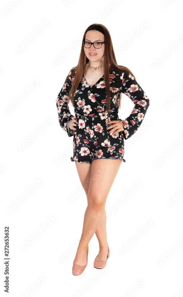 Beautiful teenage girl standing in shorts from the front Beautiful teenage girl standing in shorts from the front