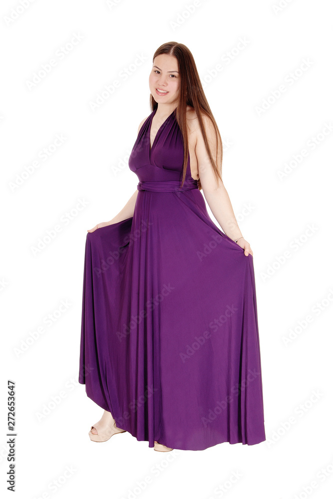 Naklejka premium Teenager girl standing in her burgundy prom dress