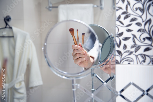 Brushes in woman hand