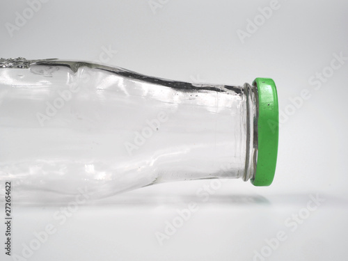 Empty bottle of glass with green lid