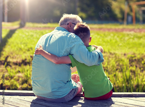 фотографія family, generation, relations and people concept - happy grandfather and grandso