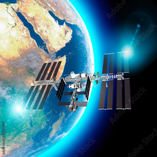 Fototapeta Naklejka Na Ścianę i Meble -  The International Space Station (ISS) is a space station, or a habitable artificial satellite, in low Earth orbit. Satellite view of the earth and ISS. Element of this images are furnished by Nasa. 3d