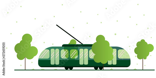 Tram surrounded by nature. Tram lines in an urban environment in summer with green trees. Eco-friendly public transport season. Weather and tram.