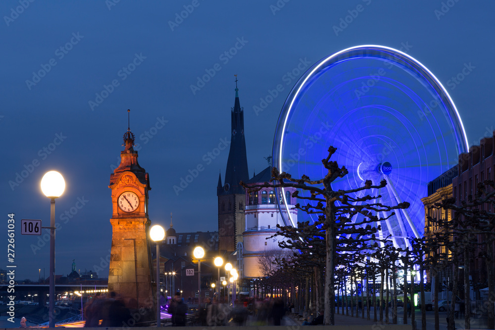 Giant wheel at the Burgplatz in Dusseldorf is part of the local christmas market on night