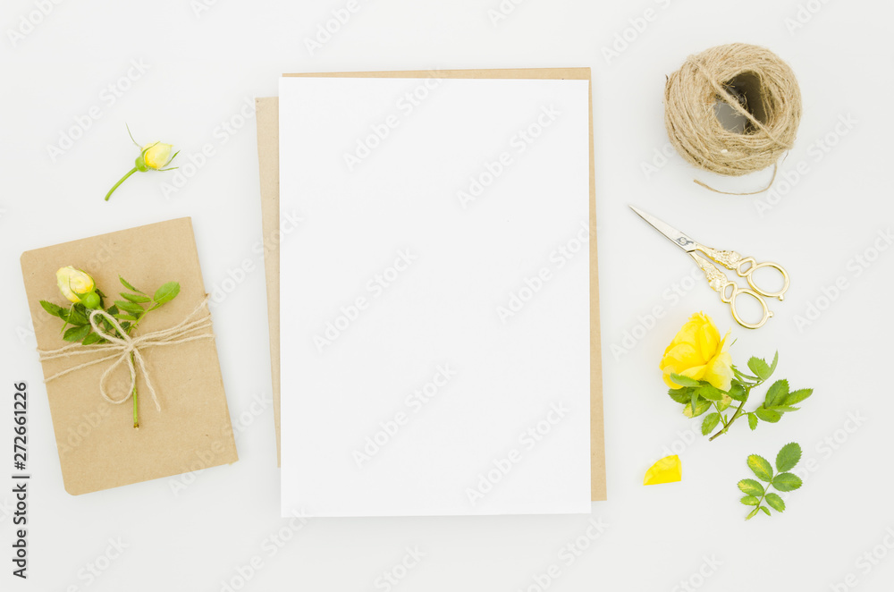 Flat lay paper mockup with floral elements Flat lay paper mockup with floral elements