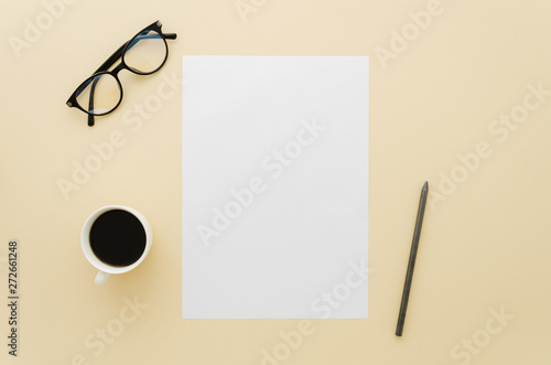 Flat lay paper mockup on workspace