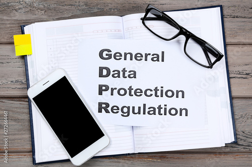 General Data Protection Regulation  GDPR with notepad  glasses and smartphone