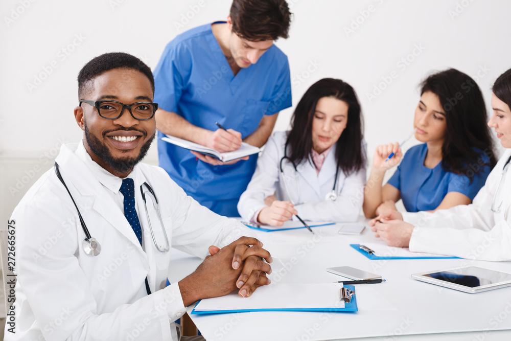 Practitioners And Interns Having Meeting In Medical Office Practitioners And Interns Having Meeting In Medical Office