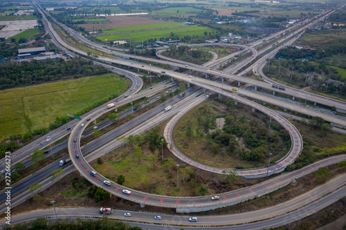 aerial view interchange freeway overpasses and motorway ring road connecting in the city transportation logistics concept in Thailand