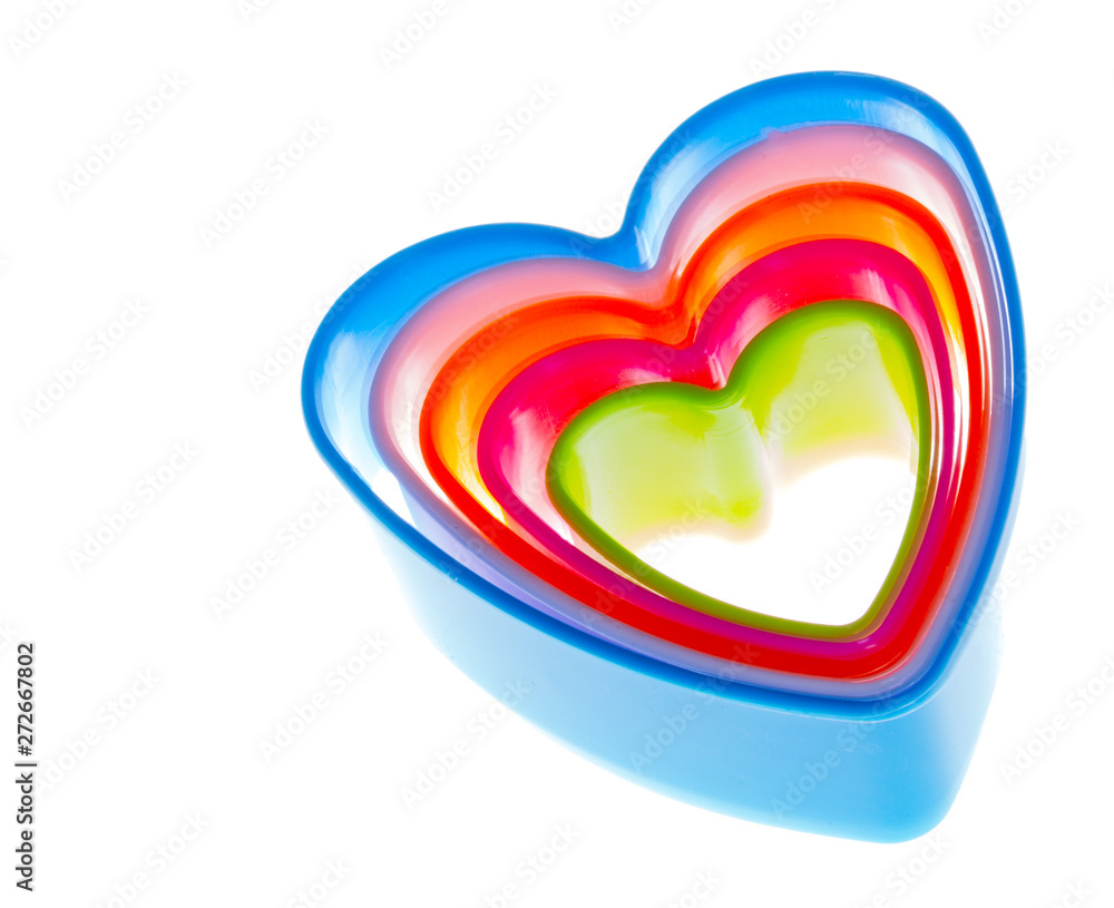Colored plastic hearts for baking, isolated on white background, no body.