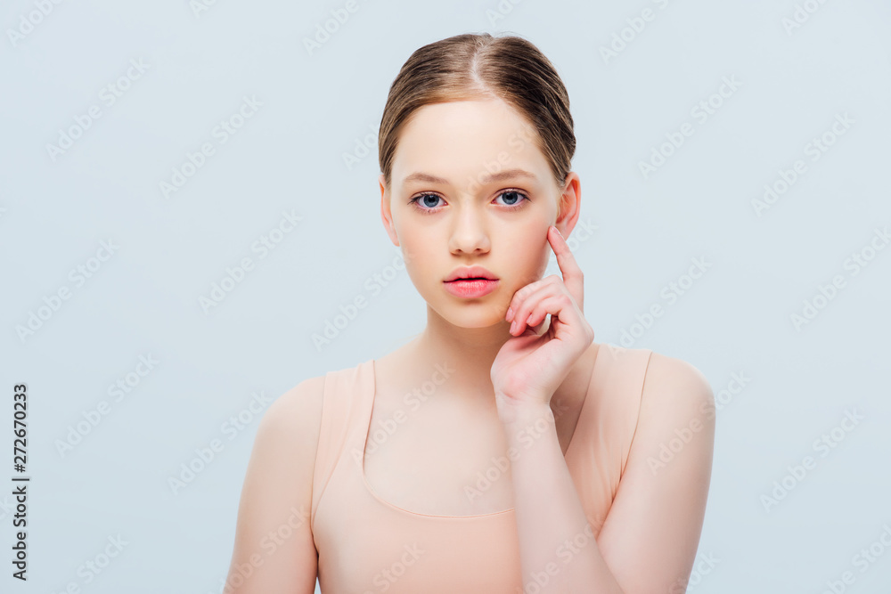 pretty pensive teenage girl looking at camera isolated on grey pretty pensive teenage girl looking at camera isolated on grey