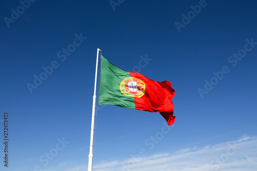 Portugal flag. The national Portuguese flag  waving on a pole. 