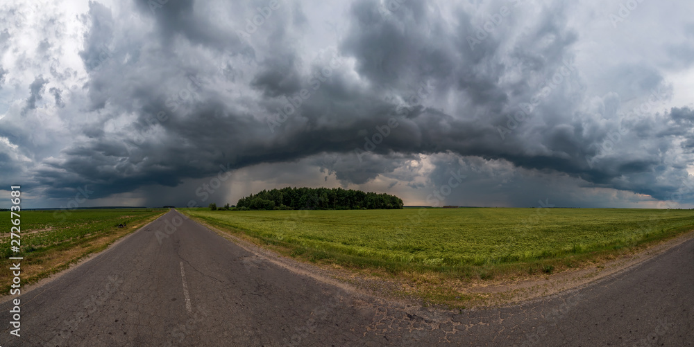 hdr panorama on asphalt road among fields in evening with awesome black clouds before storm hdr panorama on asphalt road among fields in evening with awesome black clouds before storm