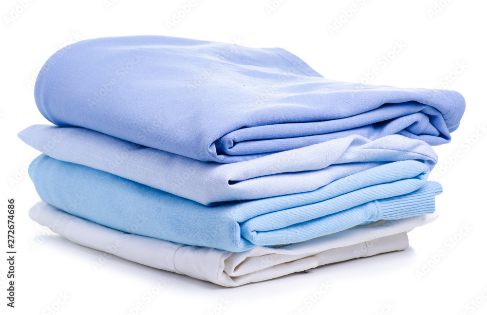 Stack blue folded clothing on white background isolation Stack blue folded clothing on white background isolation