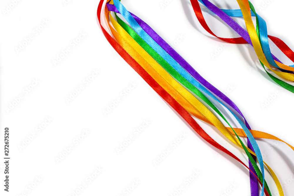 LGBT rainbow ribbon isolated on yellow background, copy space, flat layout