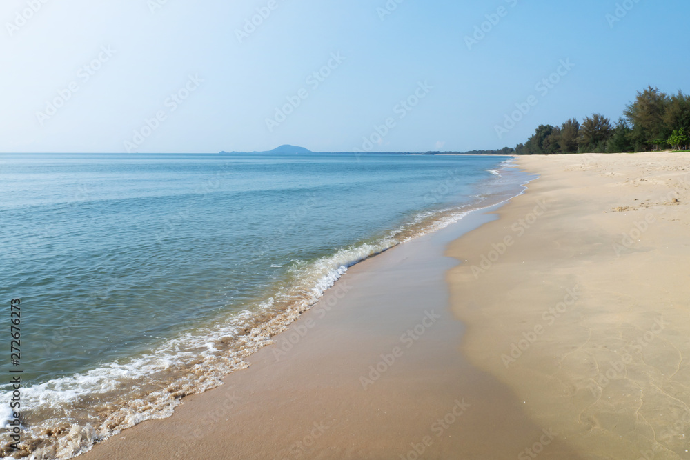 Blue sea with sand beach in sunny day. Destination for summer vacation. Natural view.