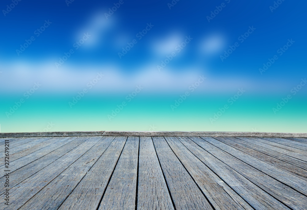  Wood floor on blurred sand beach background. beach and tropical sea