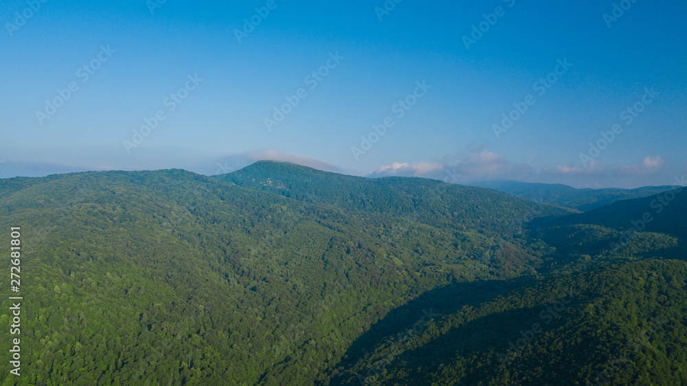 Aerial Landscape View of Caucasus mountain at sunny morning with fog.