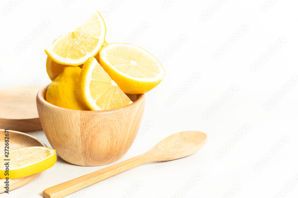 natural lemon fruit fresh vegetable with wet waterdrop, kitchen table isolated background, organic food and nutrition vitamin citrus, diet and healthy, tropical juice, wood dish cup and spoon natural lemon fruit fresh vegetable with wet waterdrop, kitchen table isolated background, organic food and nutrition vitamin citrus, diet and healthy, tropical juice, wood dish cup and spoon
