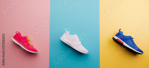 A studio shot of running shoes on bright color background. Flat lay. photo