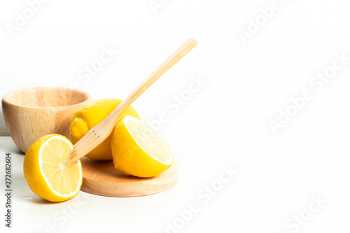 fruit fresh natural lemon vegetable with wet waterdrop, kitchen table isolated background, organic food and nutrition vitamin citrus, diet and healthy, tropical juice, wood dish cup and fork