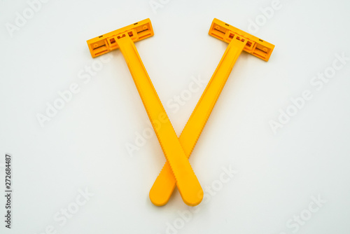 Shaving razor blades for men or women in yellow color, the object is isolated on white background