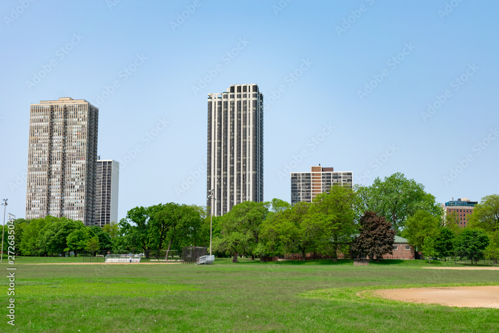 Green Open Field in Lincoln Park Chicago with Buildings