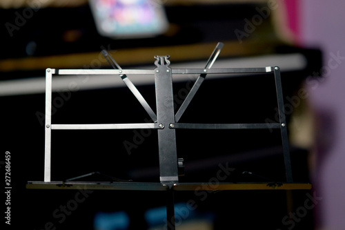 Music stand on blur piano background