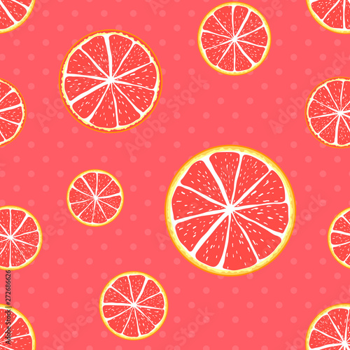 Seamless pattern grapefruit on a polka dot coral background.