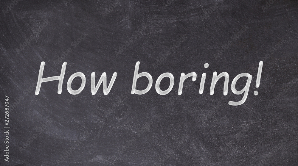 Obraz premium How boring written on blackboard