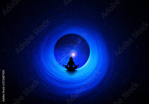 Woman in yoga pose inside of a spiral tube front universe