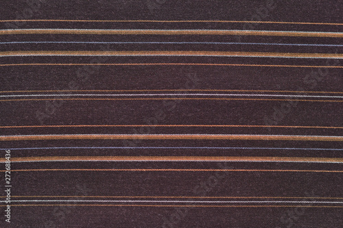 Texture tissu marron avec des rayures oranges et blanches