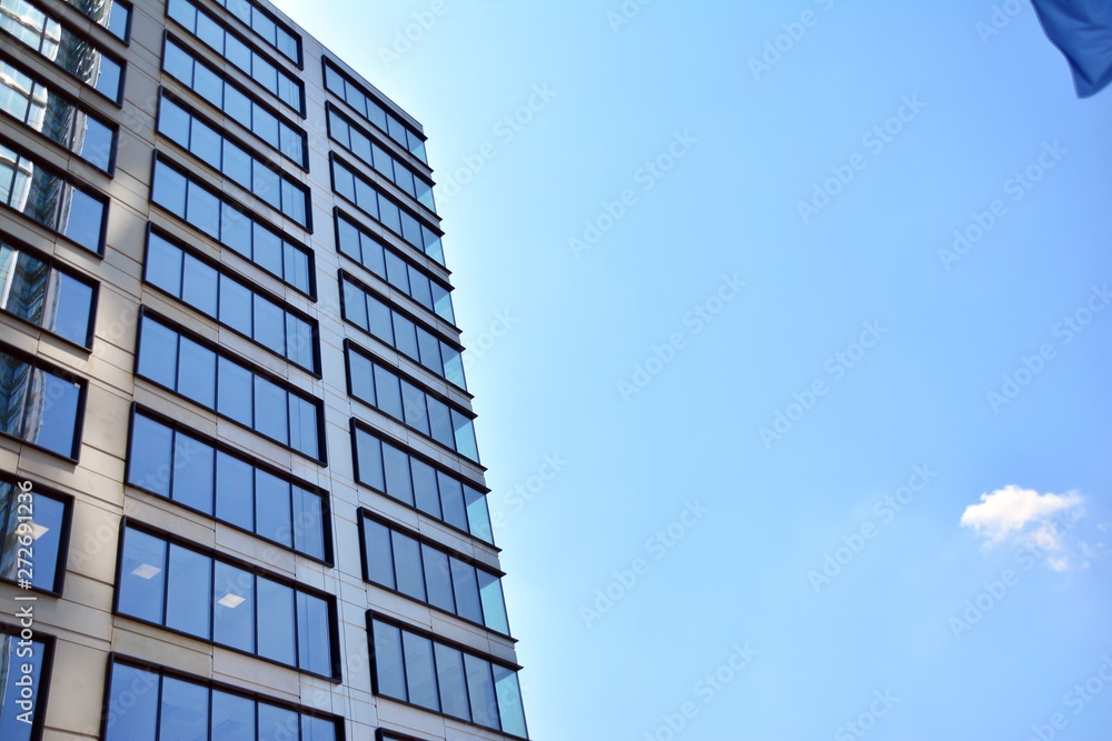 The windows of a modern building for offices. Business buildings architecture. The windows of a modern building for offices. Business buildings architecture.