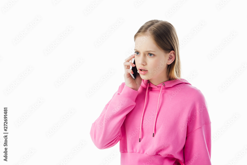 upset teenage girl in pink hoodie talking on smartphone isolated on white upset teenage girl in pink hoodie talking on smartphone isolated on white