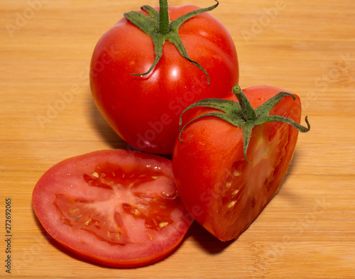 fresh tomatoes on a wooden board