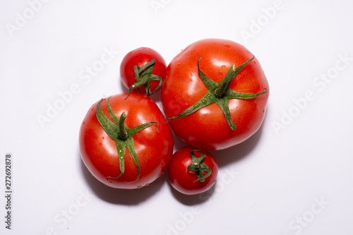 fresh tomatoes on white background