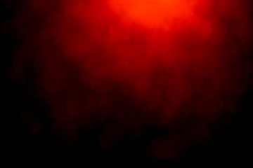Red bokeh mistical abstract background. Defocused light.