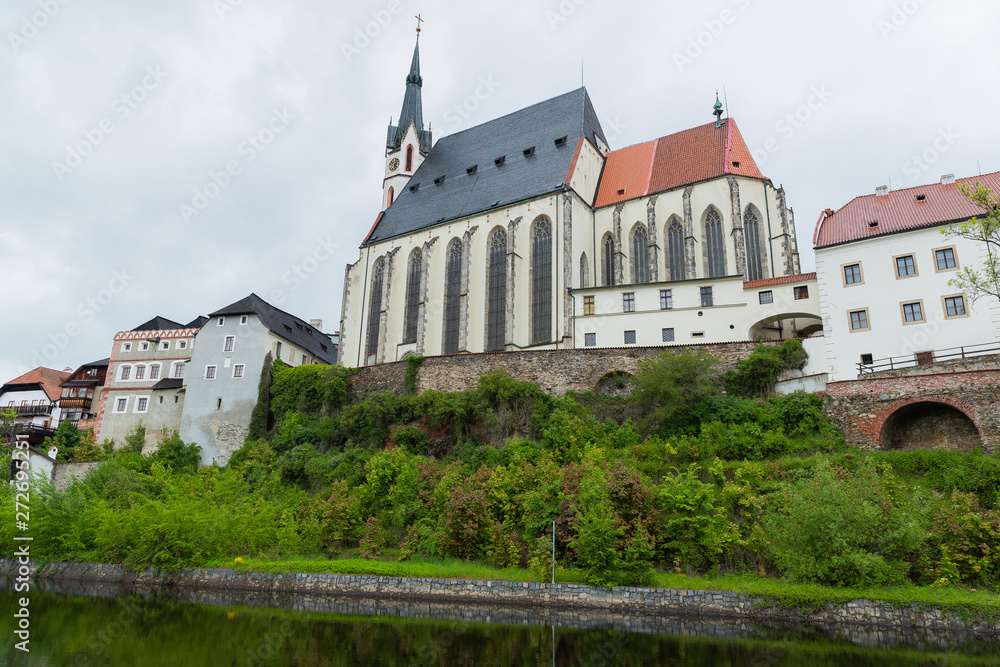 Panoramic landscape view of the historic city of Cesky Krumlov with famous Church city is on a UNESCO World Heritage Site captured during spring with nice sky and clouds