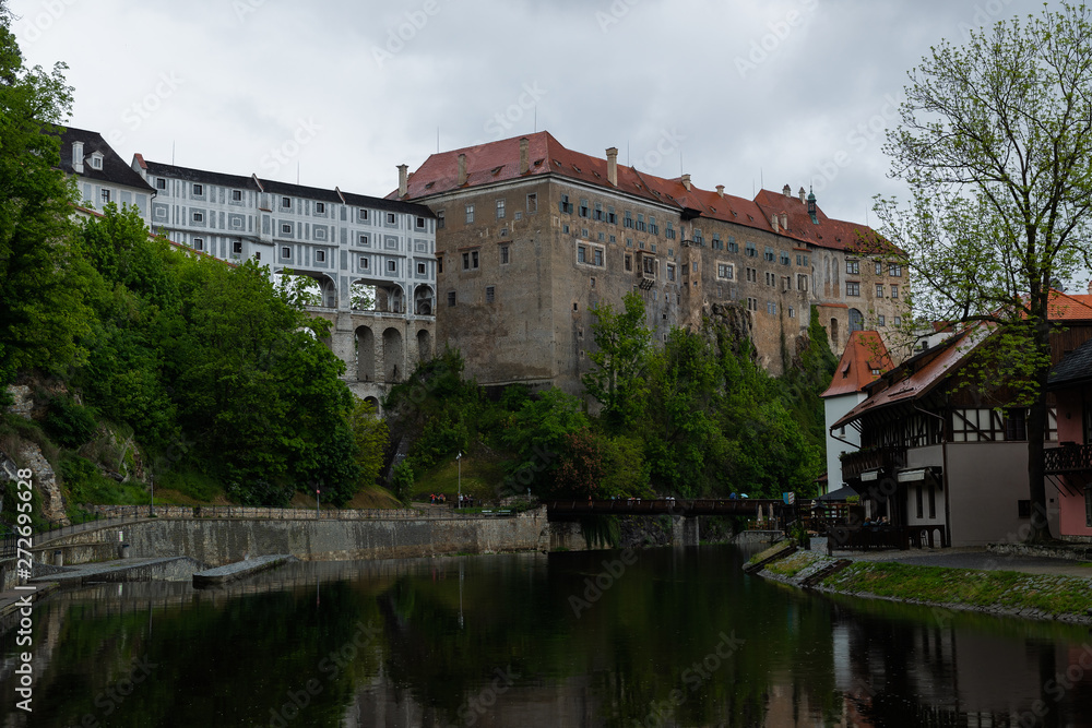 Panoramic landscape view on river Vltava in the historic city of Cesky Krumlov with famous Church city is on a UNESCO World Heritage Site captured during spring with nice sky and clouds