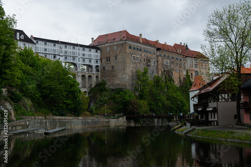 Panoramic landscape view on river Vltava in the historic city of Cesky Krumlov with famous Church city is on a UNESCO World Heritage Site captured during spring with nice sky and clouds © Lukas